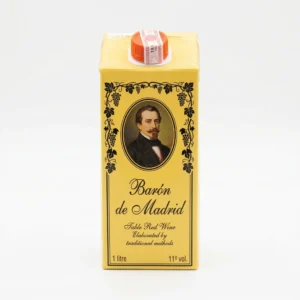Bouteille Baron de Madrid rouge sur table de fête camerounaise