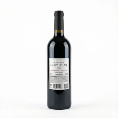 Vue de arrière de la bouteille de vin CHATEAU GARAT BEL AIR BDX 75 cl en verre sombre, montrant son étiquette blanche.