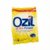 Vue de dessus du sachet rectangulaire jaune et blanc du DETERGENT OZIL ULTRA POWER 100G, aux couleurs vives et matière plastique.