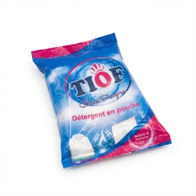 Vue de latérale du DETERGENT TIOF 25G en sachet rectangulaire plastique aux couleurs vives bleu et rose.