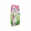 Vue latérale du sachet rose et vert de LAIT EN SACHET LA BERGERE INSTANT 25 g avec l'illustration d'une fermière et la table des valeurs nutritives.