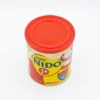 Vue de dessus d'une boîte cylindrique de lait en poudre Nestlé NIDO 1+ avec son couvercle rouge et son étiquette jaune.