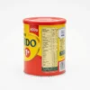Vue de côté de la boîte en métal rouge et jaune du lait en poudre NIDO 1+ de Nestlé, affichant l'étiquette nutritionnelle.