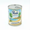 Vue de face du LAIT NON SUCRE PEAK 160G en conserve cylindrique en métal, avec une étiquette bleue, blanche et dorée.