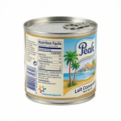 Vue de latérale du LAIT NON SUCRE PEAK 160G dans sa conserve métallique avec une étiquette bleue et dorée au décor tropical.