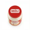 Vue de dessus du pot cylindrique de MAYONNAISE BROLI 1KG, un contenant en plastique avec un couvercle rouge et une étiquette.