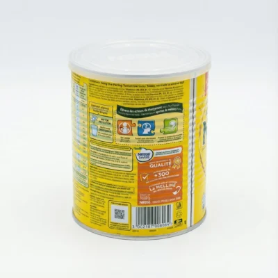 Vue arrière de la boîte cylindrique en métal NIDO 400g. L'étiquette jaune affiche les informations nutritionnelles du produit.