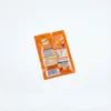 Vue de dos du sachet rectangulaire orange OVALTINE EN SACHET 18 g affichant les informations nutritionnelles sur fond blanc.