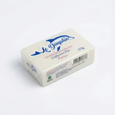 Vue de dessus du SAVON LE DAUPHIN CLASSIQUE 175G, pain rectangulaire blanc sous film plastique transparent avec logo dauphin.