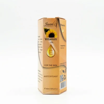 Flacon de vitamine E Juan 60ml posé devant fond neutre.